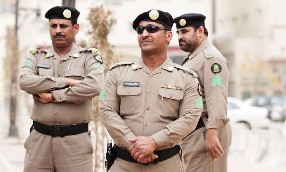 Saudi cops men checkpoint 1