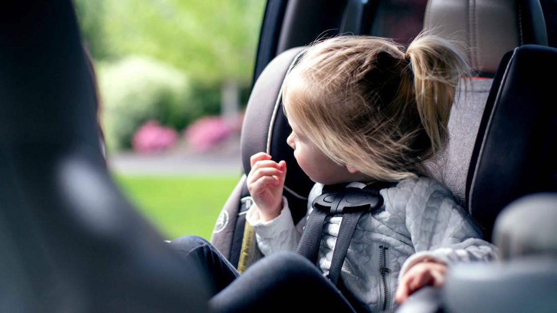 a kid who is not allowed to sit in the front seat because she is too young