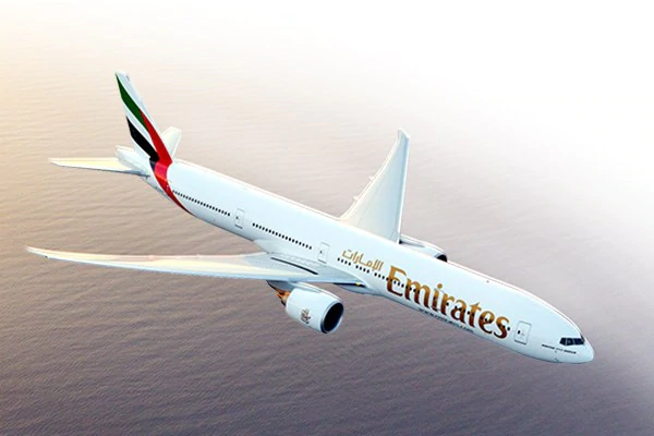 emirates boeing 777 300er flying above sea